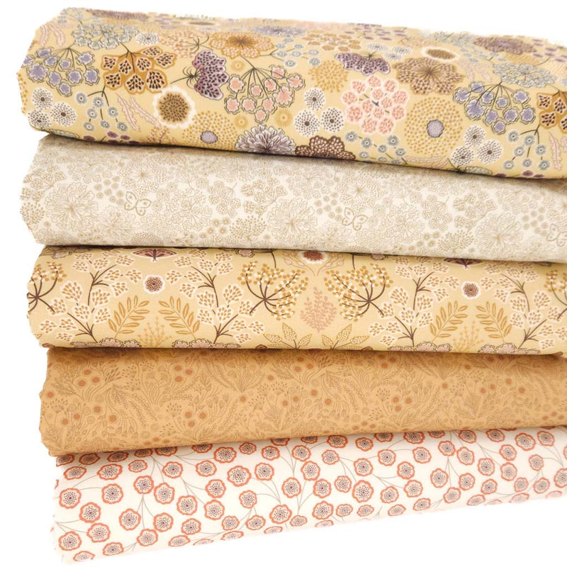 A floral fat quarter bundle in camel and autumnal designs and colours