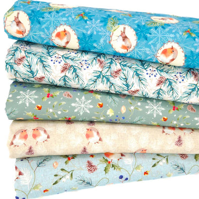 A fat quarter bundle featuring robins and holly in blue and cream