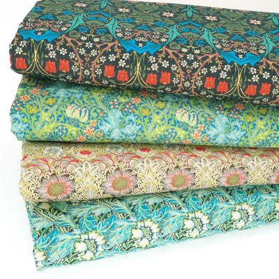 A fat quarter bundle of four percale cotton fabrics featuring the art work of William Morris
