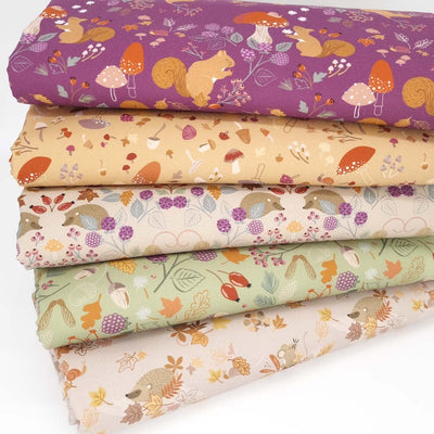 A fat quarter bundle of squirrel and hedgehog prints by Lewis & Irene