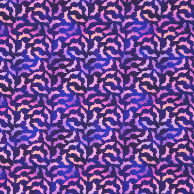 Patterned cotton halloween fabric with purple and pink bat design