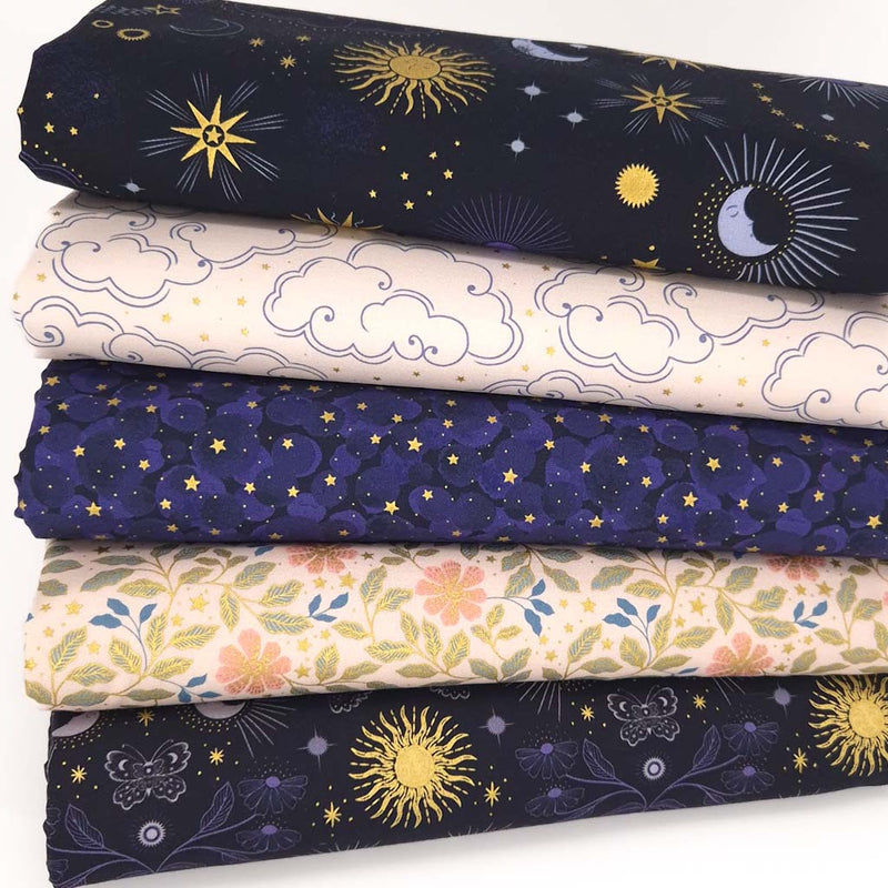 A cotton fat quarter bundle of celestial prints in dark