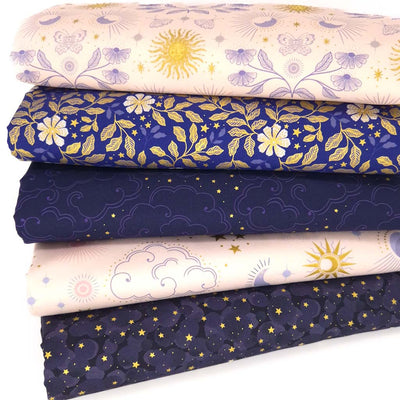 A cotton fat quarter bundle of celestial prints in light cream