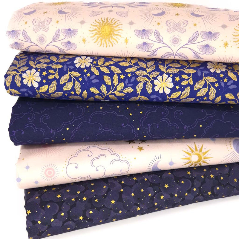 A cotton fat quarter bundle of celestial prints in light cream