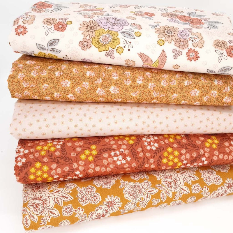 A fat quarter bundle of five cotton quilting fabrics with floral prints and birds by Lewis & Irene