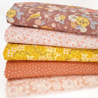A fat quarter bundle of five cotton quilting fabrics with floral prints by Lewis & Irene