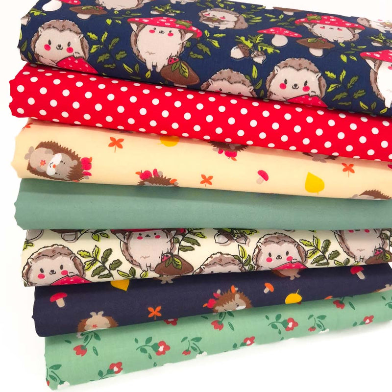 A fat quarter bundle of seven hedgehog fabric prints on polycotton fabric