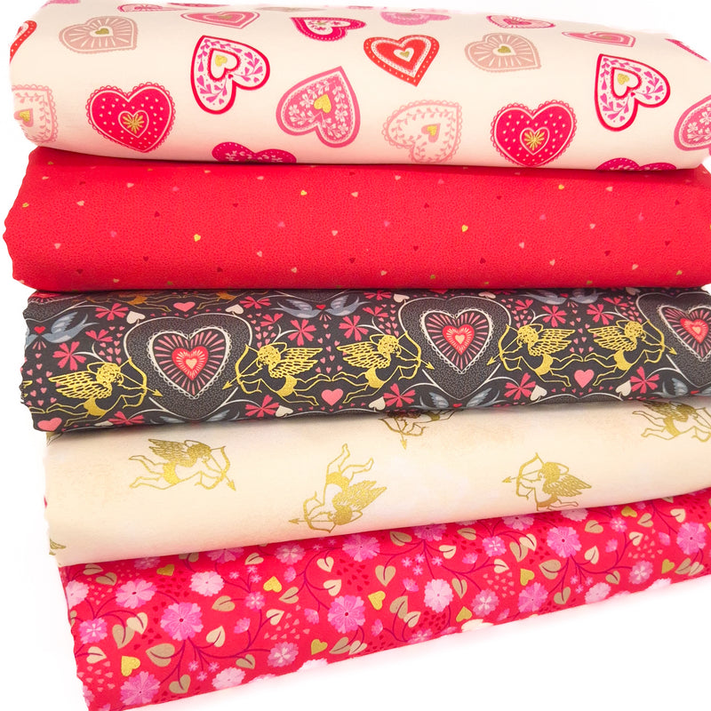 A fat quarter bundle of five love themed prints by Lewis & Irene