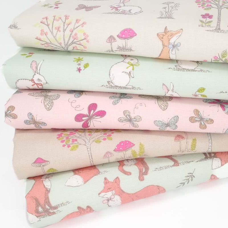 A cotton fat quarter bundle with five woodland animal designs including fox, rabbits, hedgehogs and butterflies