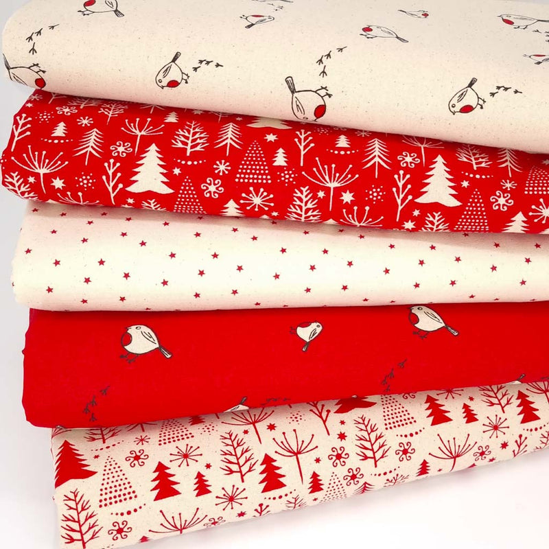 A christmas fat quarter bundle of 5 fabric prints featuring robins and christmas trees on natural cotton