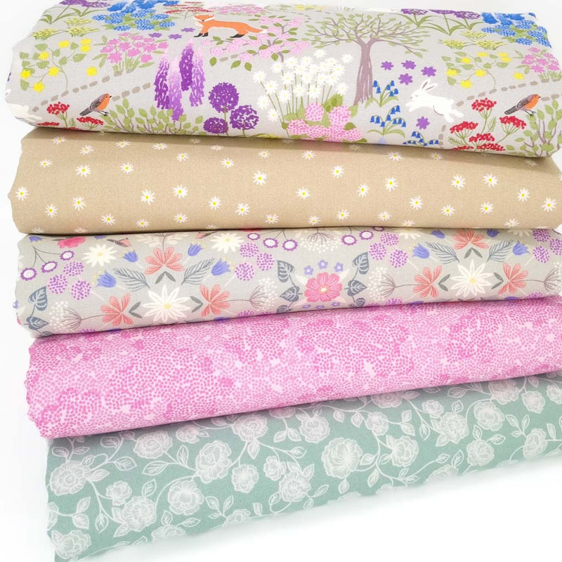 A fat quarter bundle of 5 cotton printed fabrics with a secret garden and floral blenders