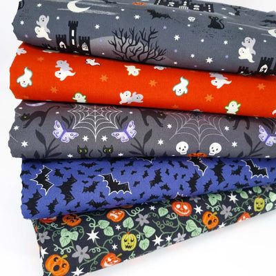 A halloween themed fat quarter bundle with ghosts and bats in purple and charcoal
