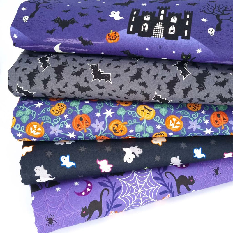 A halloween fat quarter bundle with ghosts, pumpkins and bats in purple and grey colourways