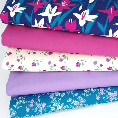 5 floral polycotton fat quarters in navy, magenta and cream colourways.