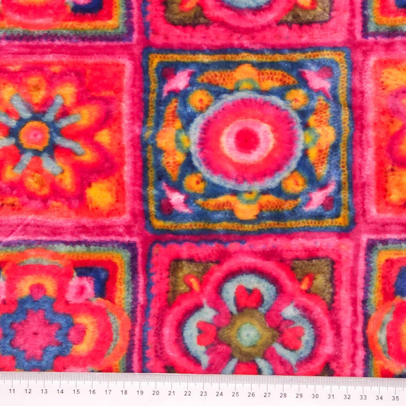 A 3D crochet design in pink printed on a cuddle fleece fabric with a cm ruler