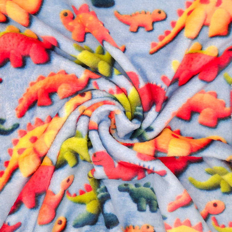 Pattern of colourful dinosaur toys on a blue cuddle fleece with folds