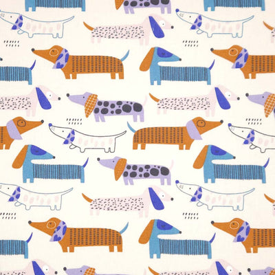 Pattern of colourful dachshunds on an ivory canvas fabric