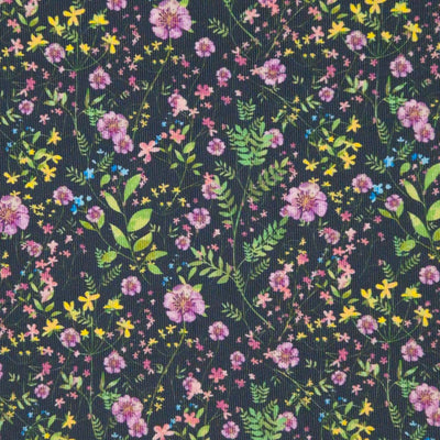 Floral design printed on a black cotton needlecord fabric