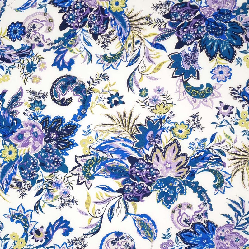A large purple floral fabric printed on a white viscose fabric for dressmaking