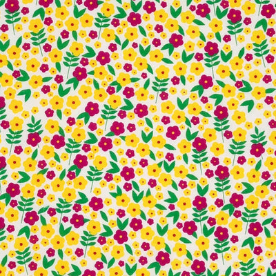 Bright mustard and purple buttercup flowers are printed on this polycotton fabric