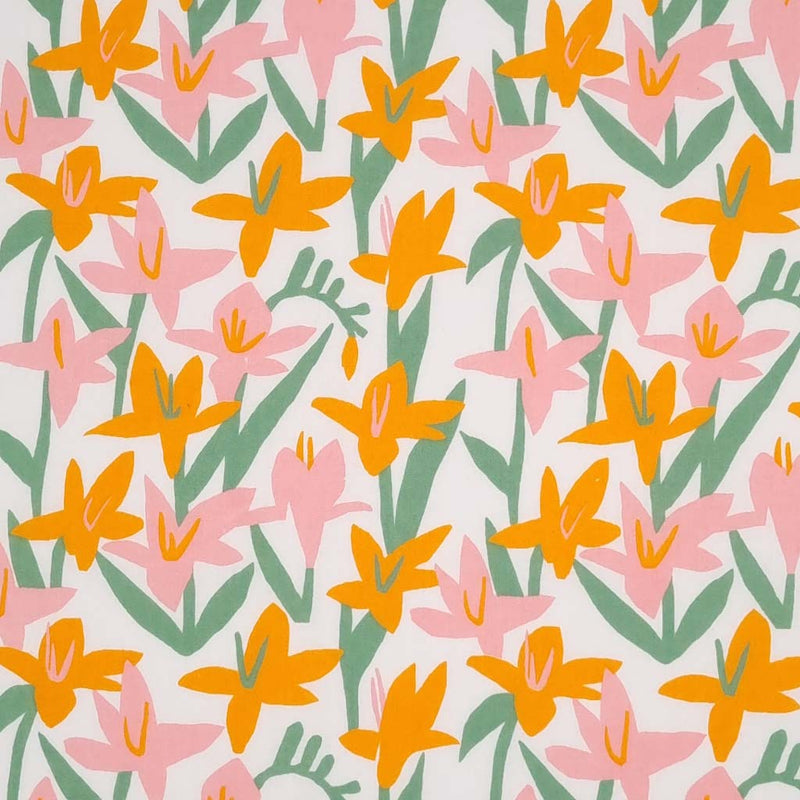 Pink and orange Lily flowers are printed on a white polycotton fabric.