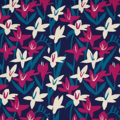 Cerise and cream Lily flowers are printed on a navy polycotton fabric.