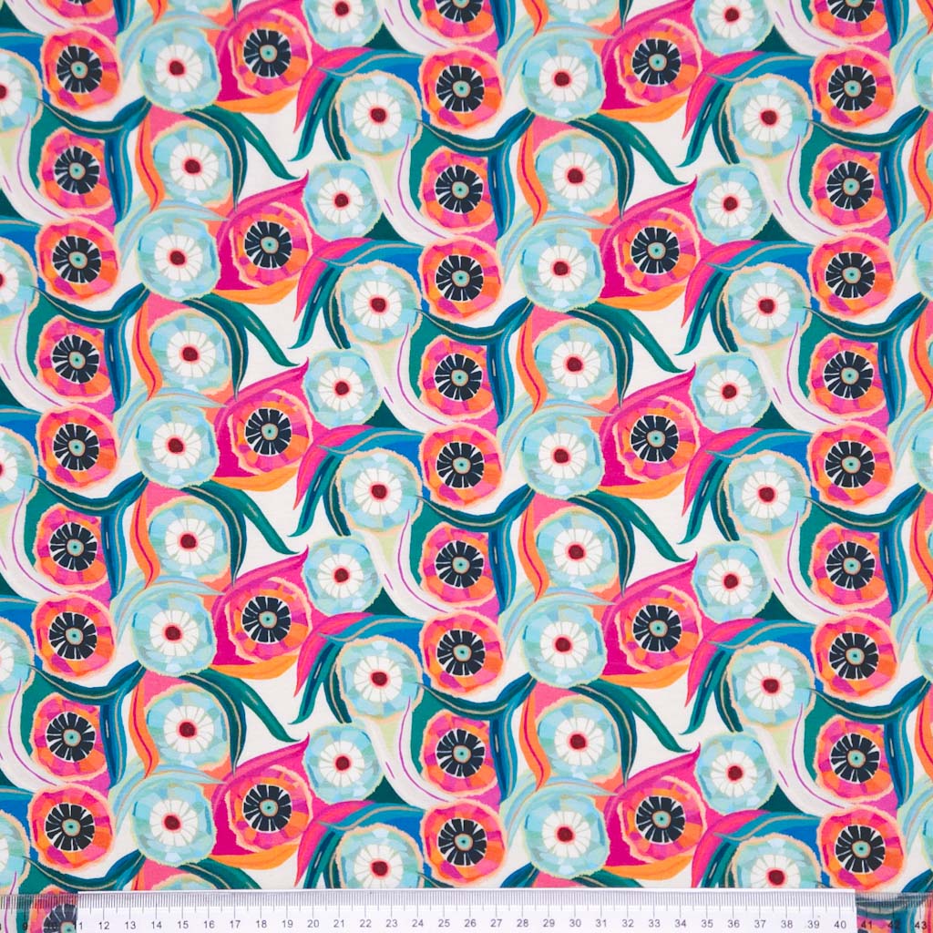 A retro flower design printed on a cotton jersey fabric with a cm ruler
