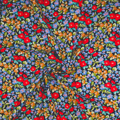 Colorful floral pattern on a black pima cotton lawn fabric