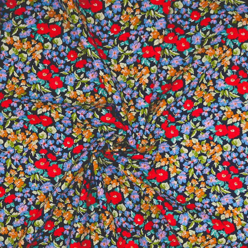 Colorful floral pattern on a black pima cotton lawn fabric