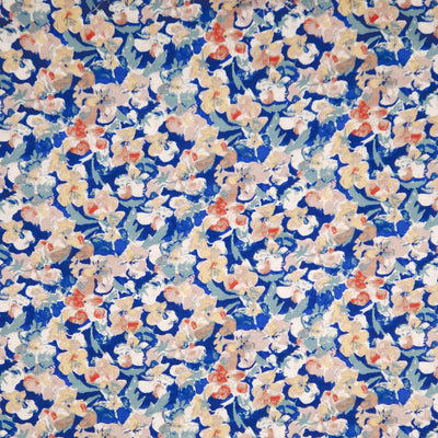 Floral pattern with small flowers in red, white, and blue on a blue viscose fabric
