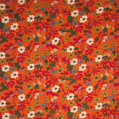 Floral pattern on an orange viscose fabric