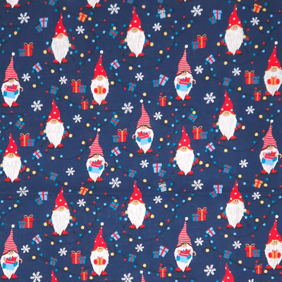 Pattern of Christmas gnomes, presents, and snowflakes on a blue cotton fabric
