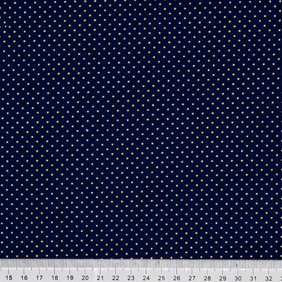 2mm gold lacquer pin spots on a navy blue christmas cotton fabric with a cm ruler