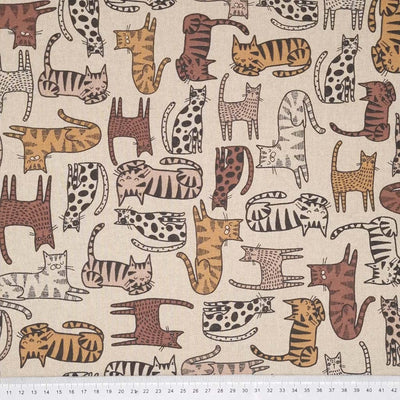 Cats are printed on a beige half panama fabric with a cm ruler