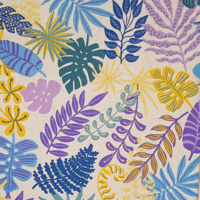 Lilac and blue tropical leaves are printed on a half panama fabric