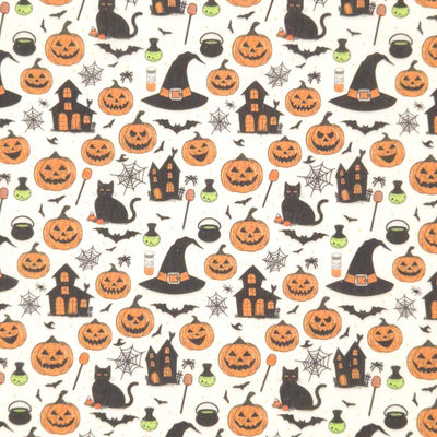 Halloween-themed pattern with pumpkins, cats, houses, and witches' hats on a cream polycotton fabric.