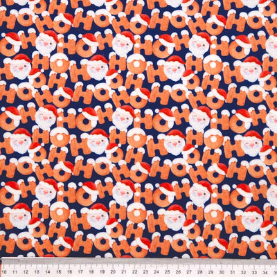 Pattern of Santa Claus faces and 'HO HO HO' text on a blue polycotton fabric