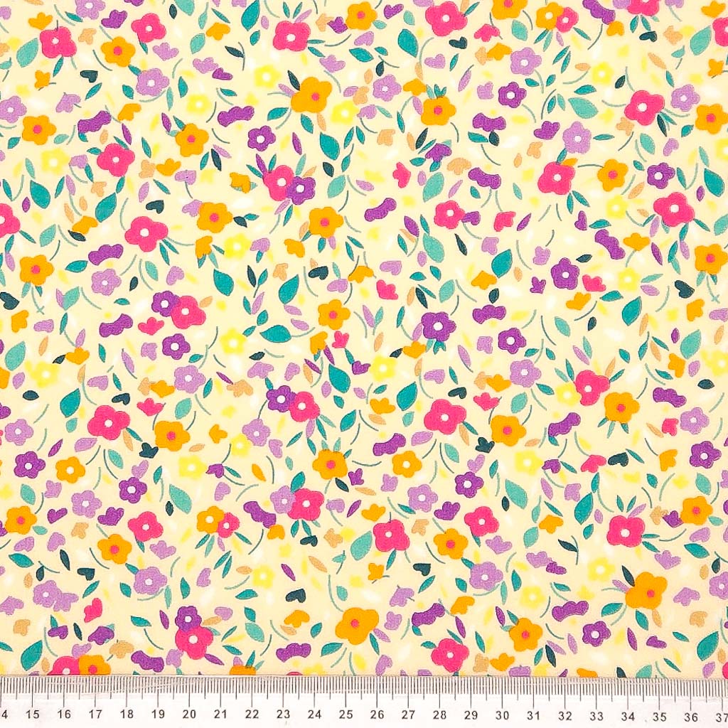 Ditsy flowers printed on a cotton poplin fabric with a cm ruler