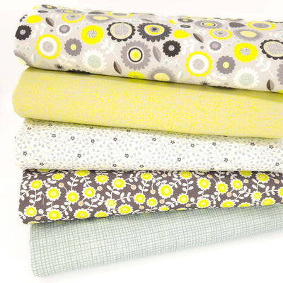 A fat quarter bundle with floral and checkered patterns on a white background