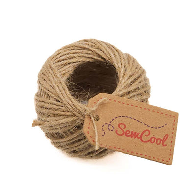 Ball of twine with a 'Sew Cool' tag on a white background