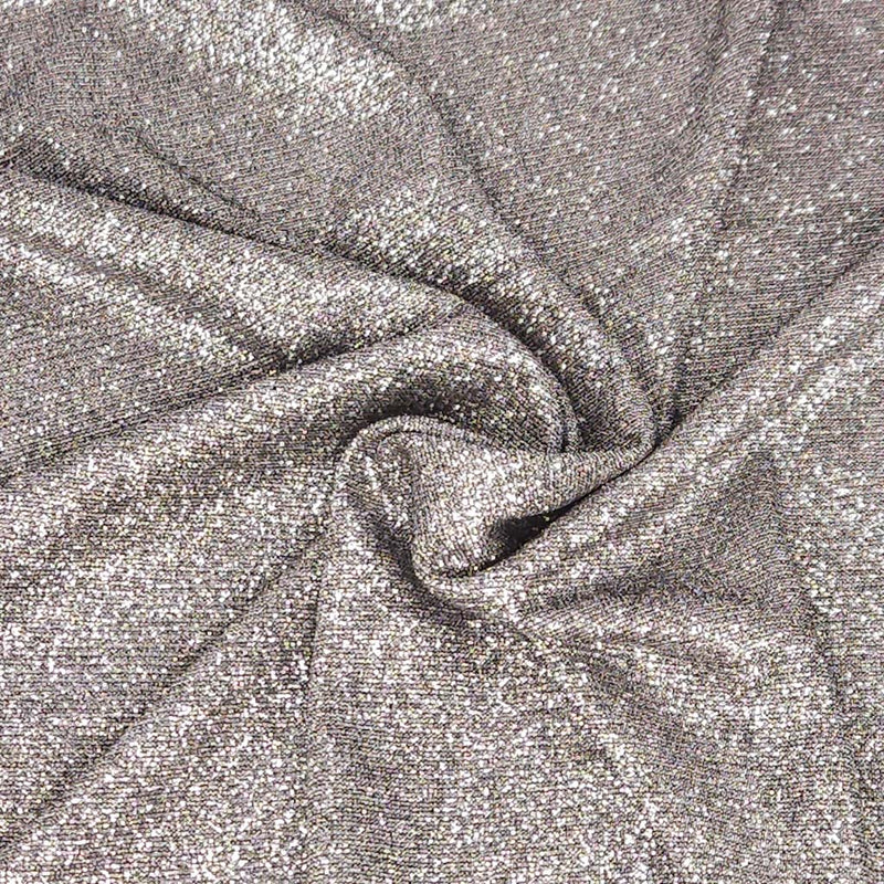 Close-up of silver glittery fabric with folds