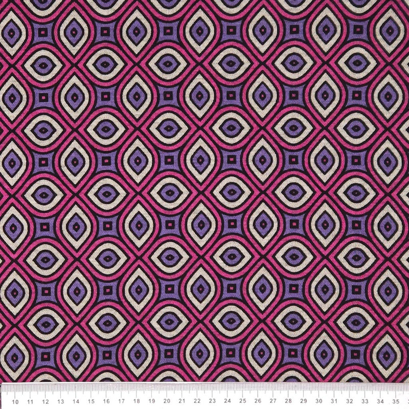 Geometric pattern fabric with pink and purple design on a white ponteroma fabric
