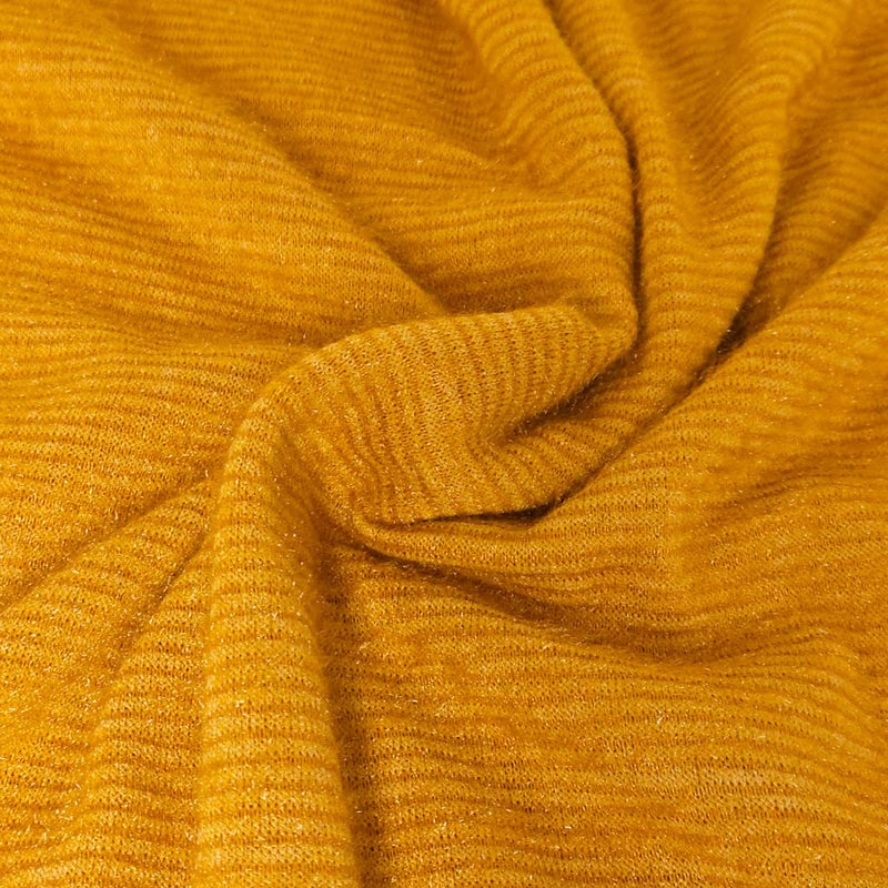 Close-up of textured mustard yellow fabric