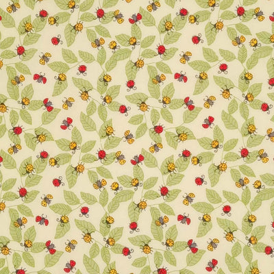 Red and yellow ladybirds printed on an ivory polycotton fabric