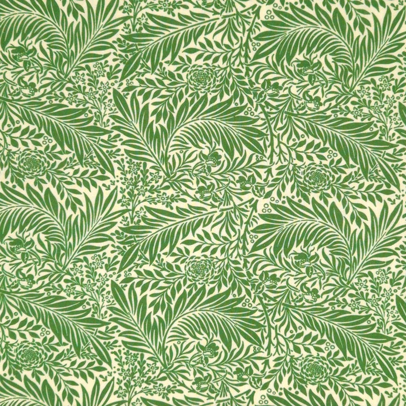 Sage green larkspur leaves printed on a cream cotton fabric