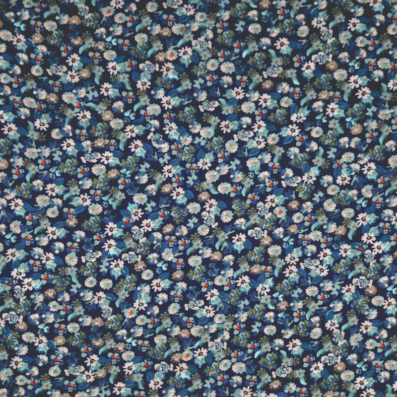 Floral pattern fabric with small flowers on a dark blue viscose fabric