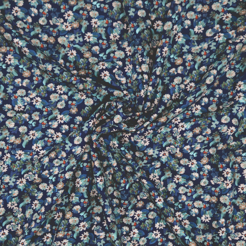 Floral pattern fabric with small flowers on a dark blue viscose fabric