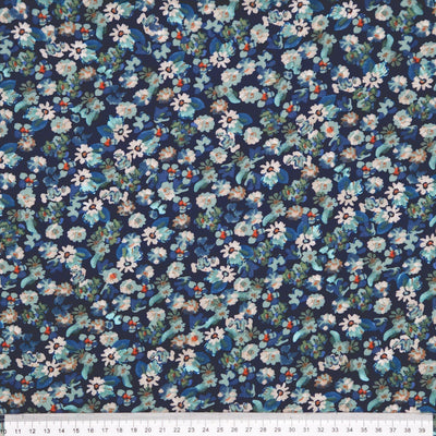 Floral pattern fabric with small flowers on a dark blue viscose fabric with a ruler