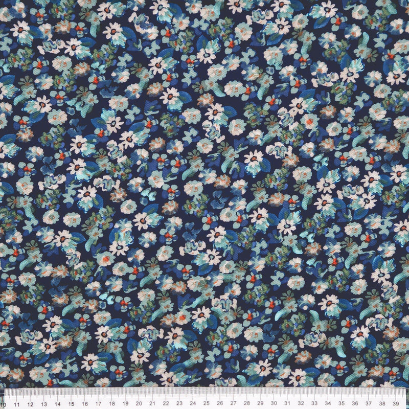 Floral pattern fabric with small flowers on a dark blue viscose fabric with a ruler