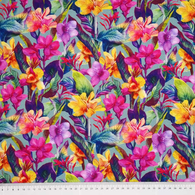 Vibrant coloured flowers are printed on a mint linen fabric with a cm ruler